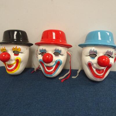 LOT 129. THREE DECORATIVE CLOWN MASK