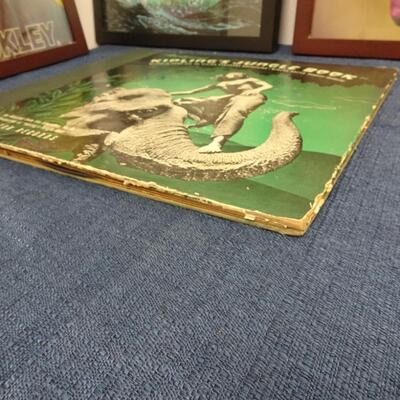 LOT 193. THREE FRAMED ALBUM COVERS AND JUNGLE BOOK ALBUM