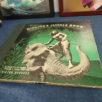 LOT 193. THREE FRAMED ALBUM COVERS AND JUNGLE BOOK ALBUM