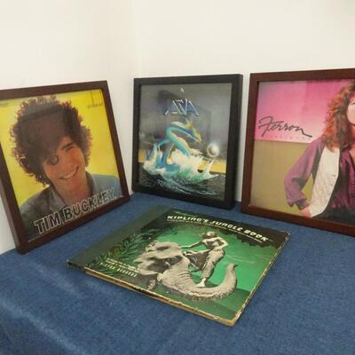 LOT 193. THREE FRAMED ALBUM COVERS AND JUNGLE BOOK ALBUM