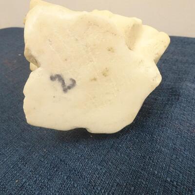 LOT 245. CARVED STONE FIGURINE
