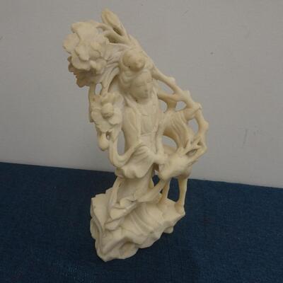 LOT 245. CARVED STONE FIGURINE