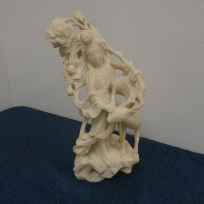 LOT 245. CARVED STONE FIGURINE