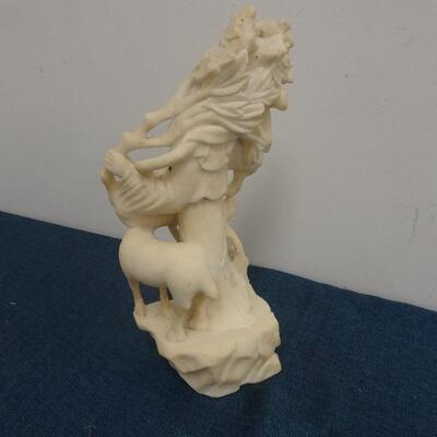 LOT 245. CARVED STONE FIGURINE