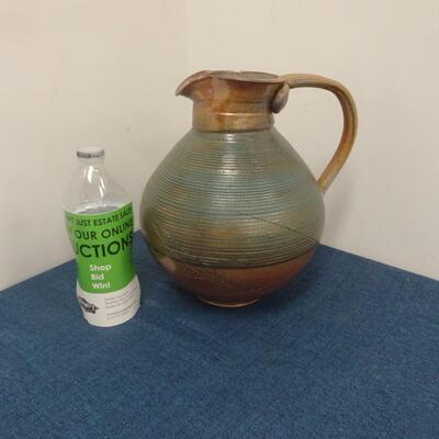 LOT 264. CERAMIC PITCHER