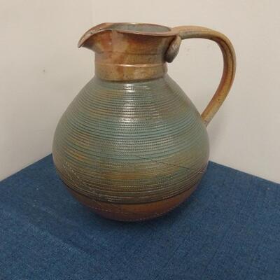 LOT 264. CERAMIC PITCHER