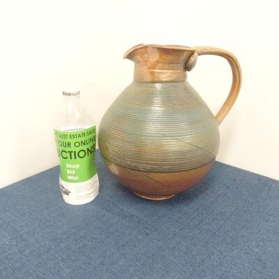 LOT 264. CERAMIC PITCHER
