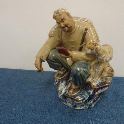 LOT 283. MUD MAN FIGURINE