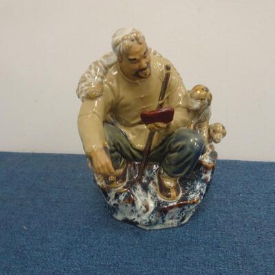 LOT 283. MUD MAN FIGURINE
