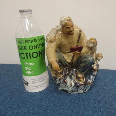 LOT 283. MUD MAN FIGURINE