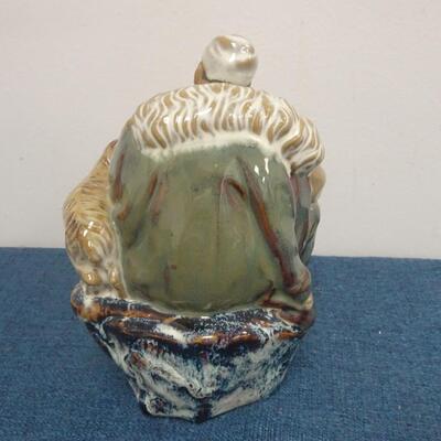 LOT 283. MUD MAN FIGURINE