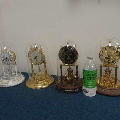 LOT 300 FOUR ANNIVERSARY CLOCKS