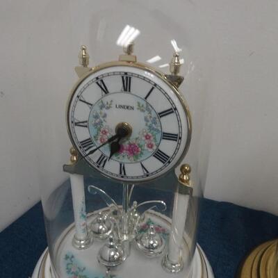 LOT 300 FOUR ANNIVERSARY CLOCKS