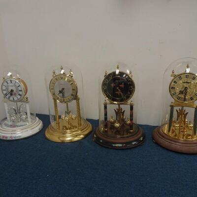 LOT 300 FOUR ANNIVERSARY CLOCKS