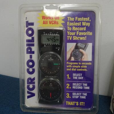 LOT 308.  MISC ITEMS. MARBLES, MODEL RAIL ROAD POWER PACK AND VCR CO PILOT
