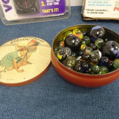 LOT 308.  MISC ITEMS. MARBLES, MODEL RAIL ROAD POWER PACK AND VCR CO PILOT
