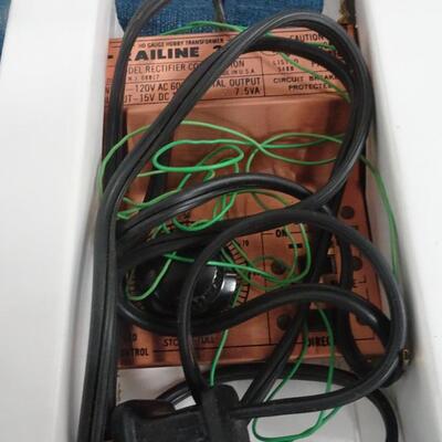 LOT 308.  MISC ITEMS. MARBLES, MODEL RAIL ROAD POWER PACK AND VCR CO PILOT