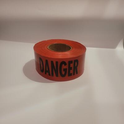 Red Danger tape roll.
