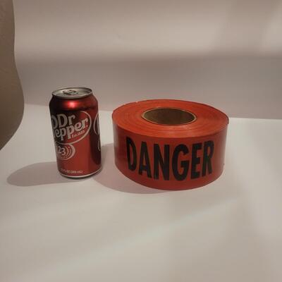 Red Danger tape roll.