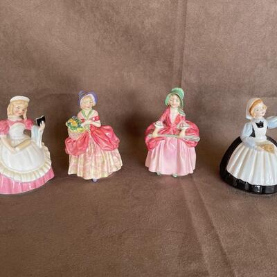 Lot 75. Four Royal Doulton Figurines
