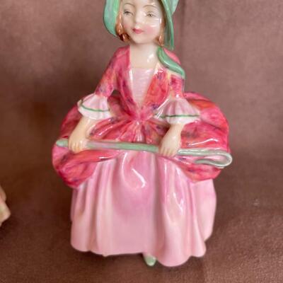 Lot 75. Four Royal Doulton Figurines