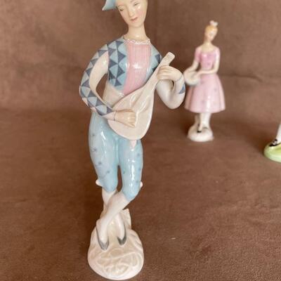 Lot 78. Three Royal Doulton Figurines
