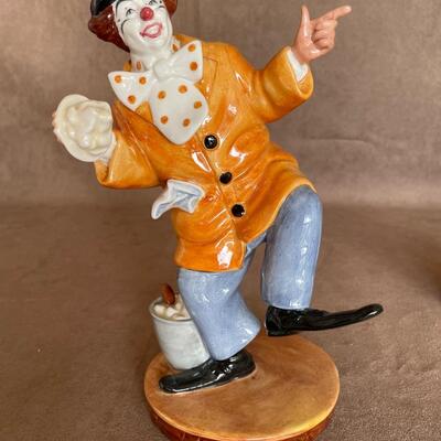 Lot 84. Two Royal Doulton Figurines