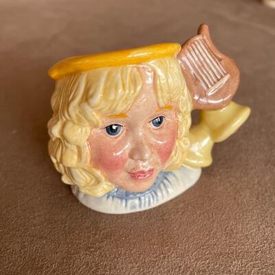 Lot 84. Two Royal Doulton Figurines