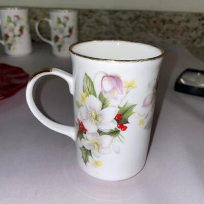 Lot 146. Set of Christmas Mugs and a Plate