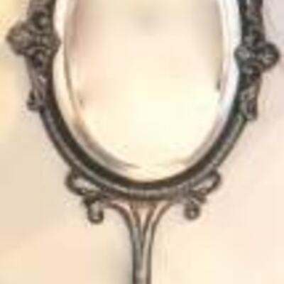 silver hand mirror with figural handle