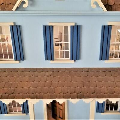 Lot #37  Dollhouse with furniture on Swivel Base
