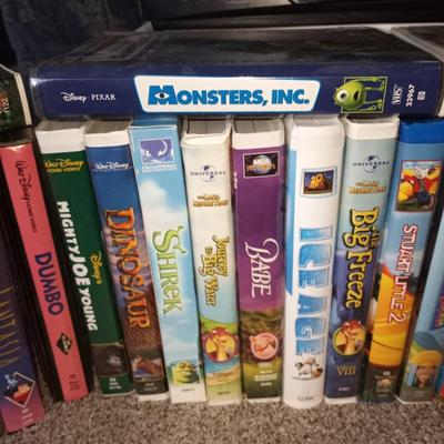 VHS HI FI STEREO VCR PLAYER AND LARGE VARIETY OF DISNEY VHS MOVIES AND OTHERS