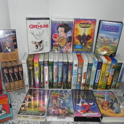 VHS HI FI STEREO VCR PLAYER AND LARGE VARIETY OF DISNEY VHS MOVIES AND OTHERS