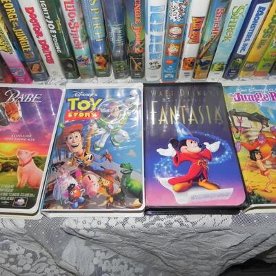 VHS HI FI STEREO VCR PLAYER AND LARGE VARIETY OF DISNEY VHS MOVIES AND OTHERS