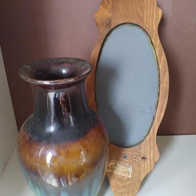 Sconce mirror and porcelain vase