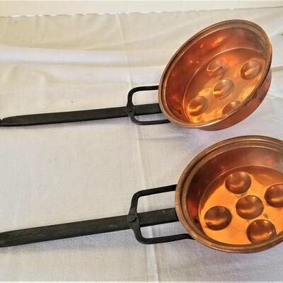 Lot #81  Pair of Copper Egg Poachers with wrought iron handles