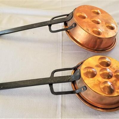 Lot #81  Pair of Copper Egg Poachers with wrought iron handles