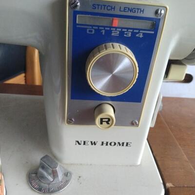 Sewing machine with folding down custom desk