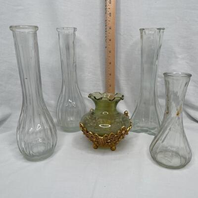 4 glass tall vases and 1 green round vase in gold metal stand
