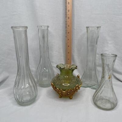4 glass tall vases and 1 green round vase in gold metal stand