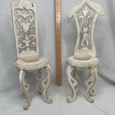 2 Decorative chairs holding candle holders