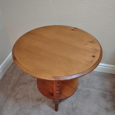 LOT 38 TWO TIERED ROUND TABLE