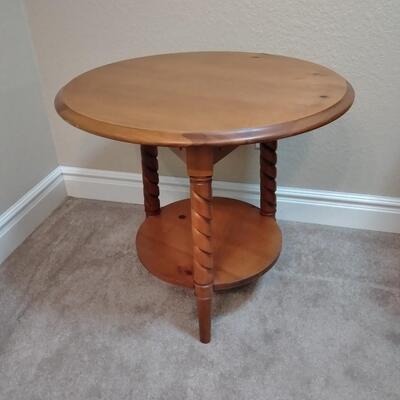 LOT 38 TWO TIERED ROUND TABLE