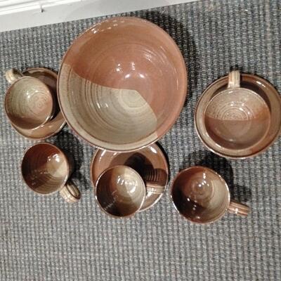LOT 94  LARGE CLAY SERVING BOWL WITH MISC CUPS AND SAUCERS