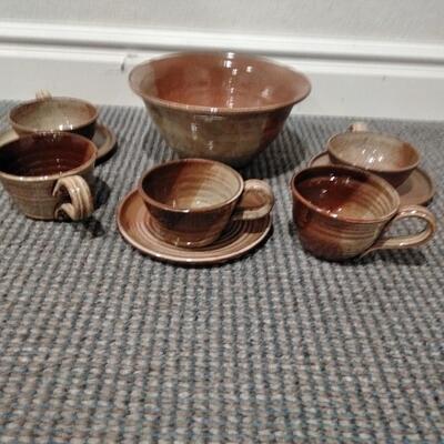 LOT 94  LARGE CLAY SERVING BOWL WITH MISC CUPS AND SAUCERS