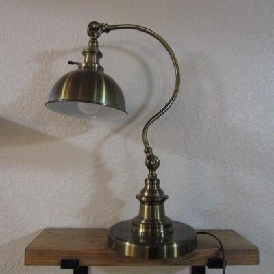 LOT 28  CURVED ADJUSTABLE ARM BRASS  LAMP