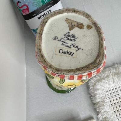 Assorted linens, fabric, trivets, vase