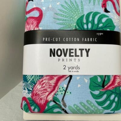 Assorted linens, fabric, trivets, vase