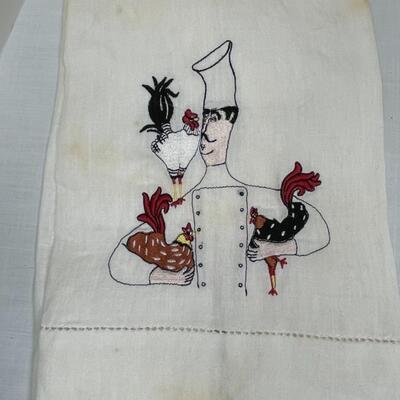 Assorted linens, fabric, trivets, vase