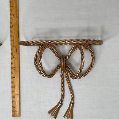 2 gold metal bow shelves